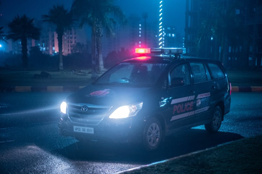 black honda car on road during night time