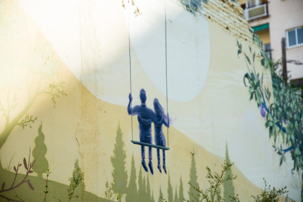 picture of couple sitting on swing